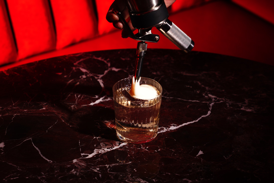 A Keeper’s Remedy served over ice with orange