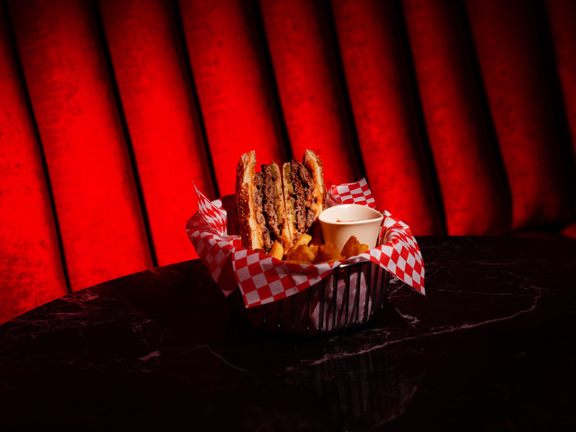 The sandwich and fries in the basket, from above